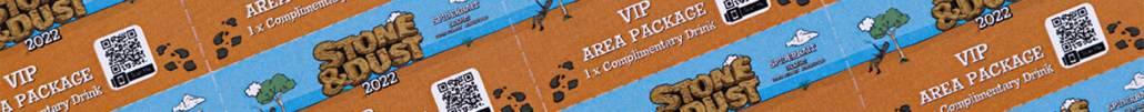 A close-up of a custom ticket book on a yellow surface.
