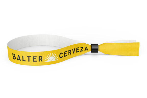 A fabric wristband in yellow and white featuring black and white logotype for "Balter Cerveza", with their logo image.