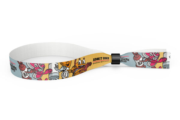 An eco-friendly fabric wristband featuring a colourful background and illustrations of cartoon characters featuring the words "Admit One".