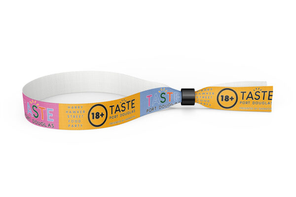 A fabric wristband with pink, yellow, and blue backgrounds, featuring the "TASTE Port Douglas" logo and an 18+ sign.