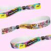 A pair of eco-friendly heat-sublimated wristbands featuring distinct designs.